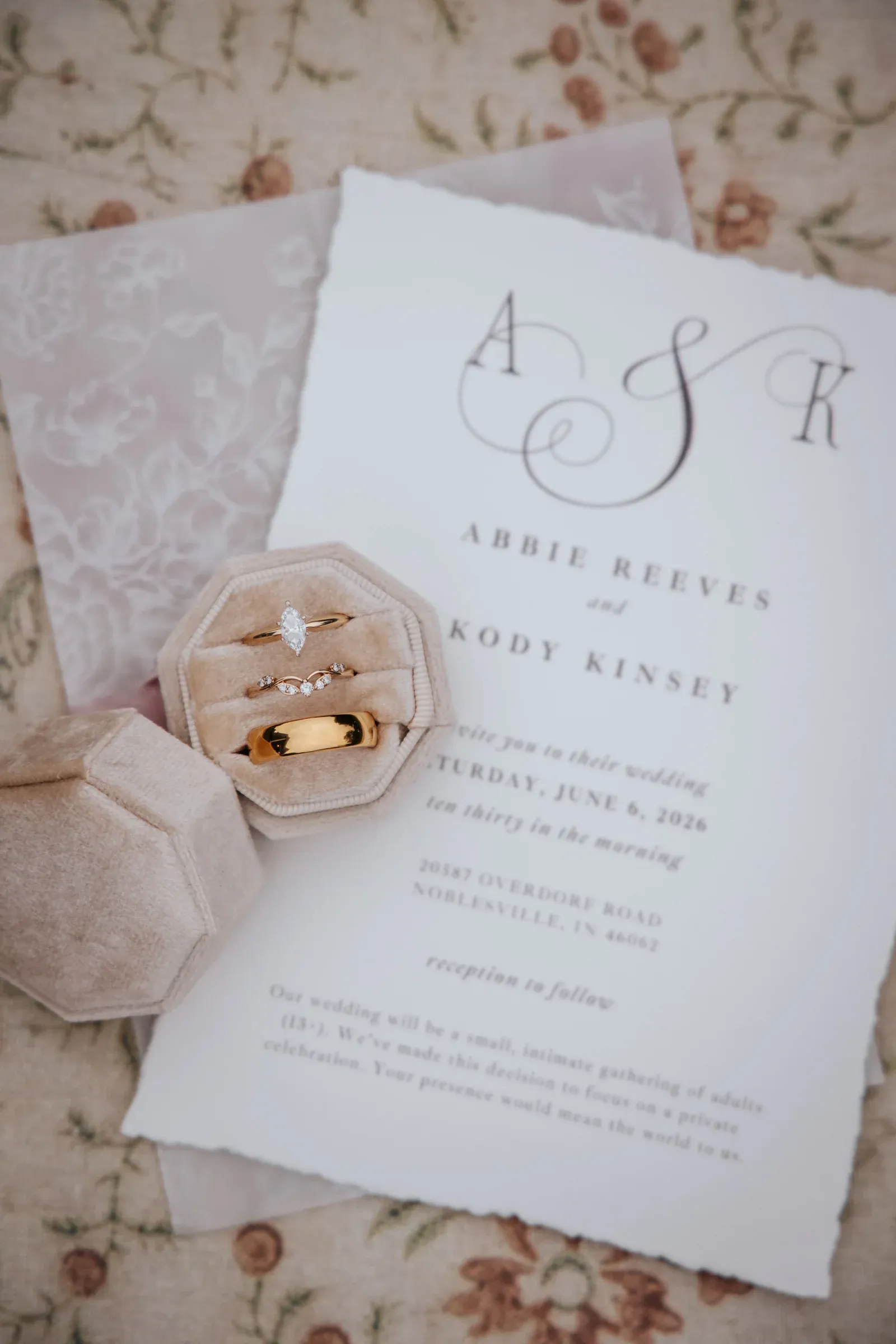 Wedding invitation suite with rings and ribbon
